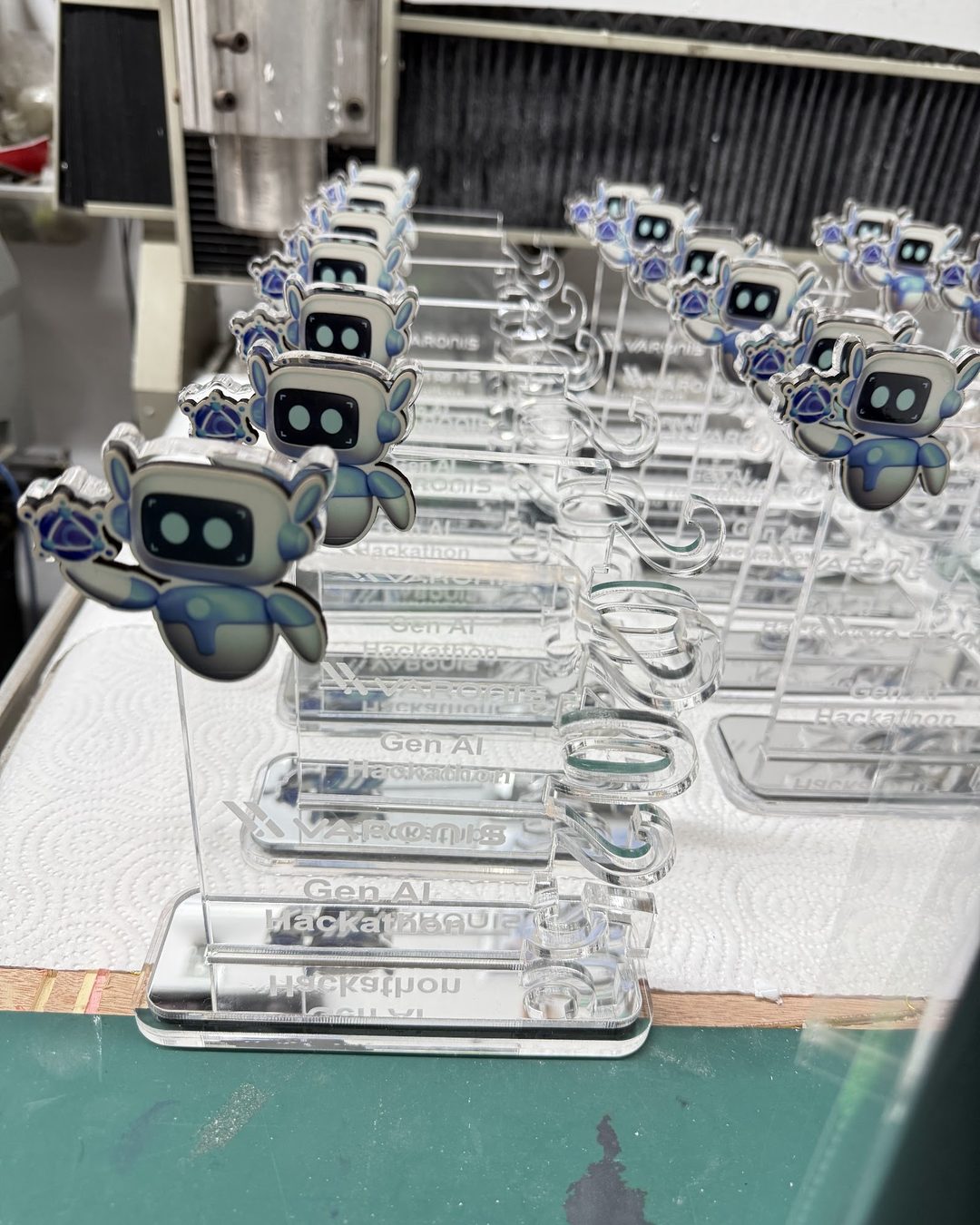 A row of acrylic awards with printed mascot figures